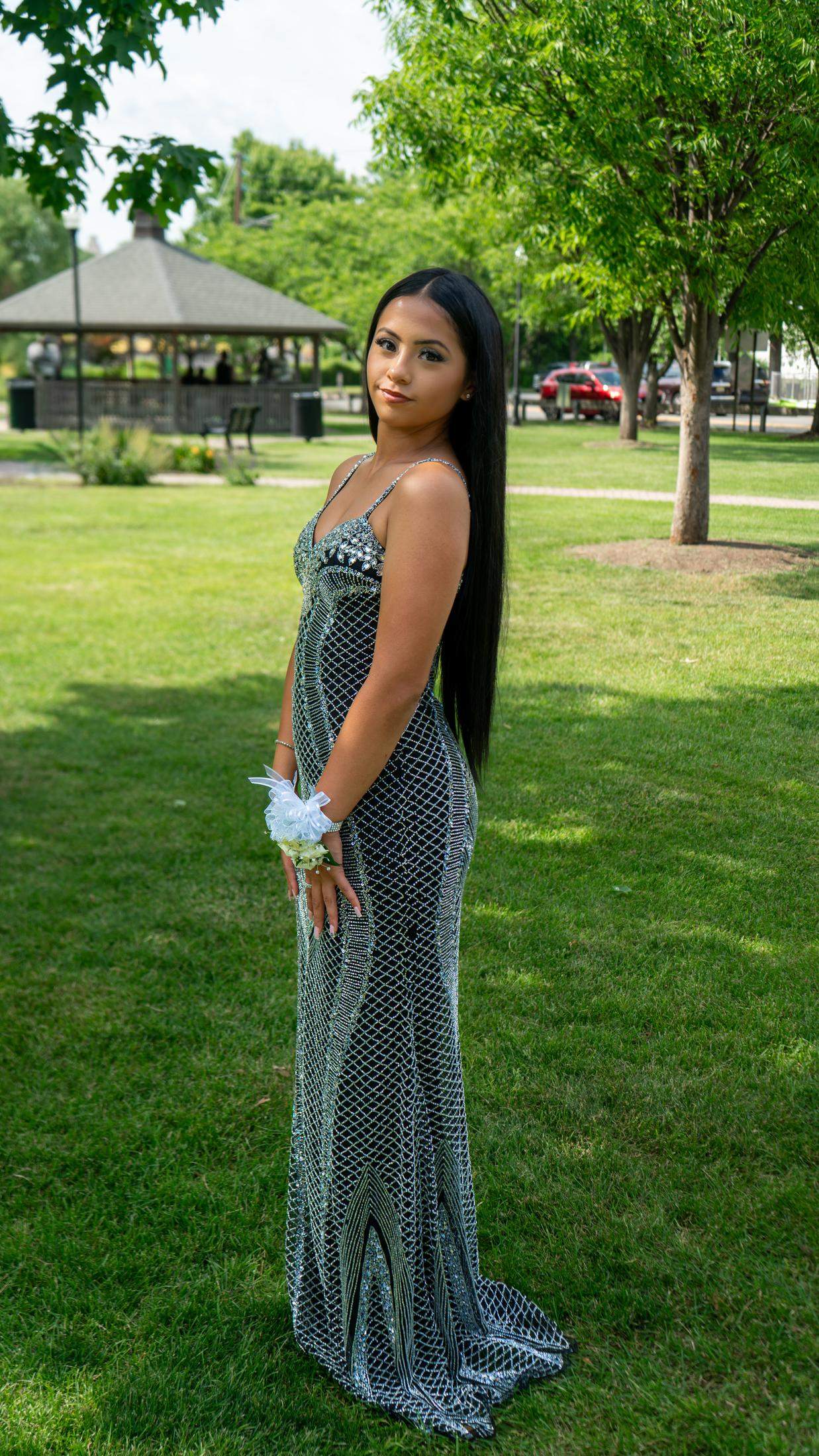 Solo prom portrait near a park gazebo