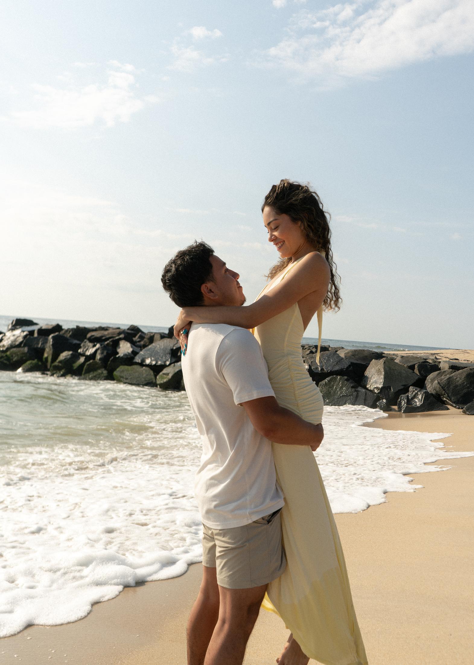 Couple portrait in golden evening light on the beach