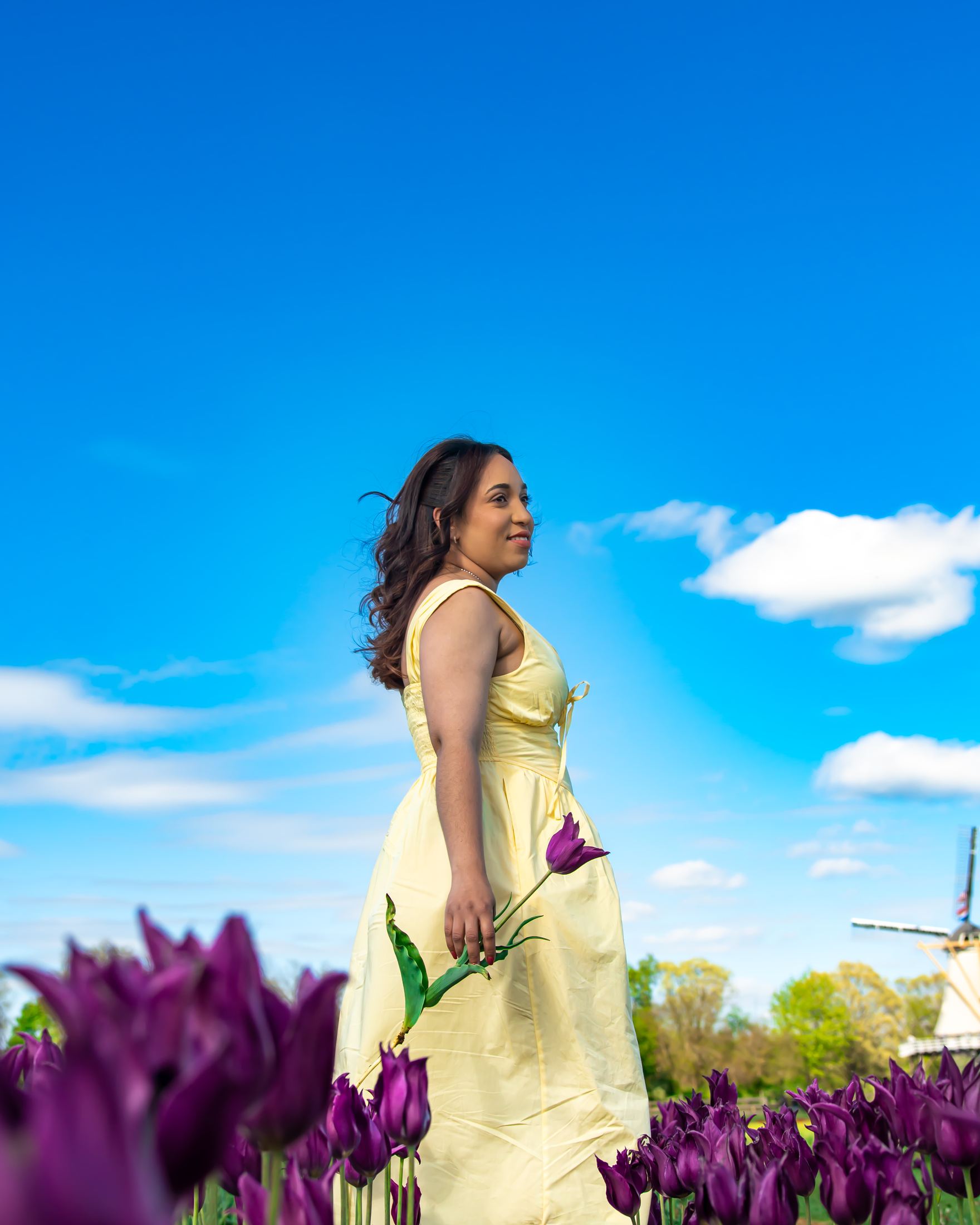 Candid profile portrait near a windmill