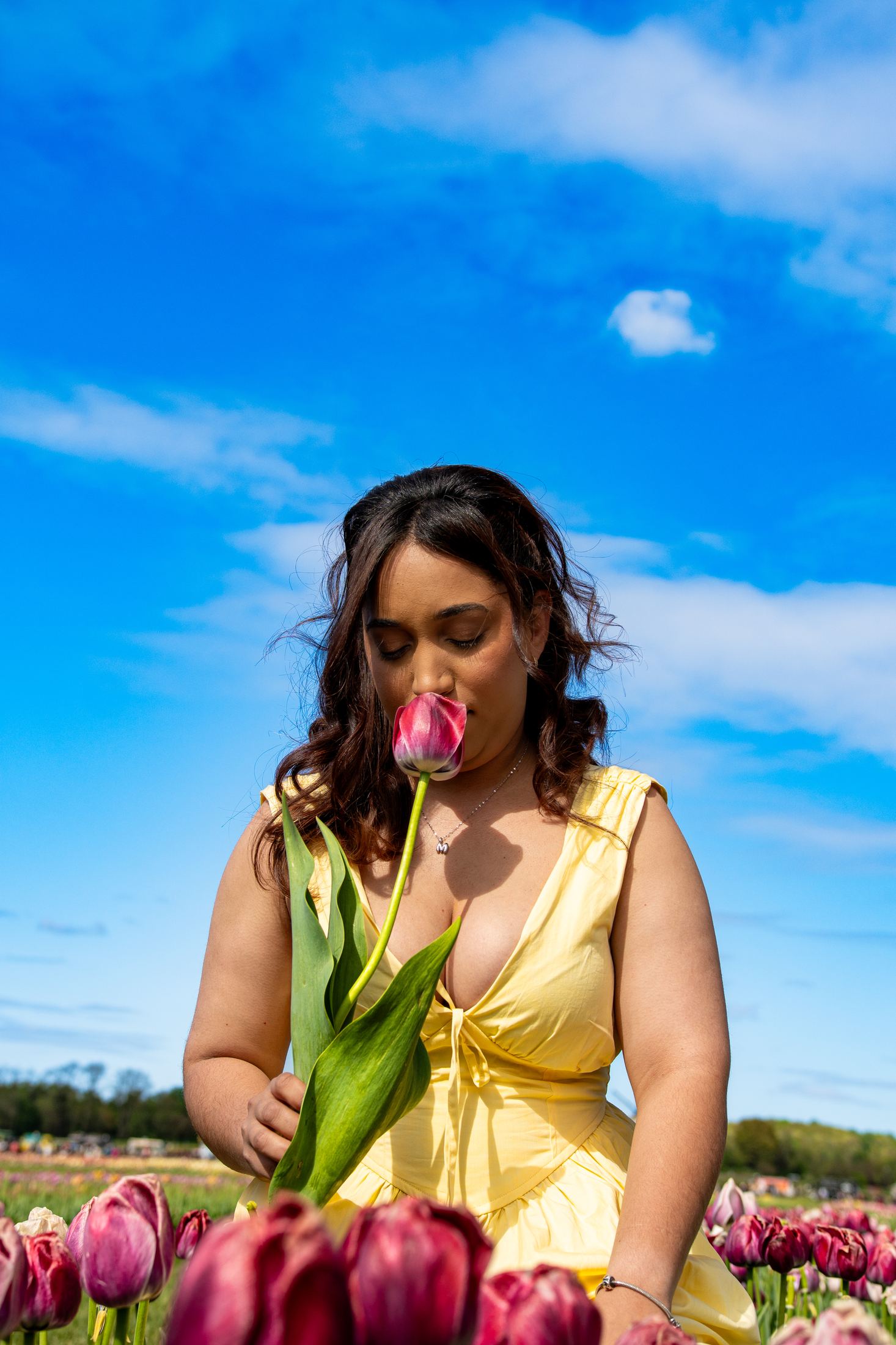Close editorial portrait with tulip
